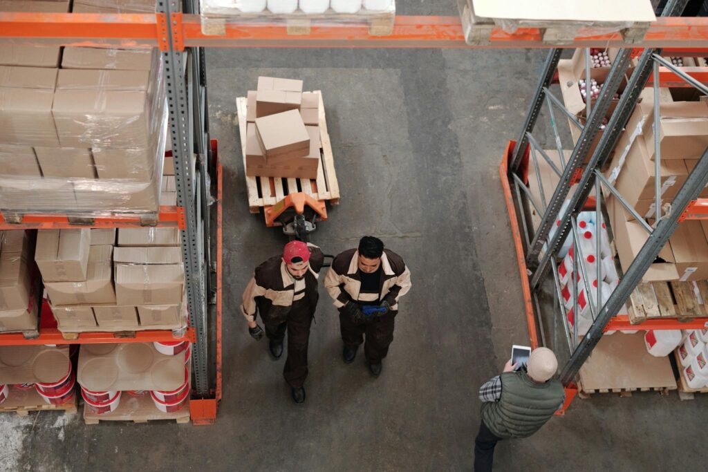 Crafting the Perfect Blog Structure: A Guide for Effective Blogging High angle view of warehouse workers organizing and preparing shipments with boxes and pallets.