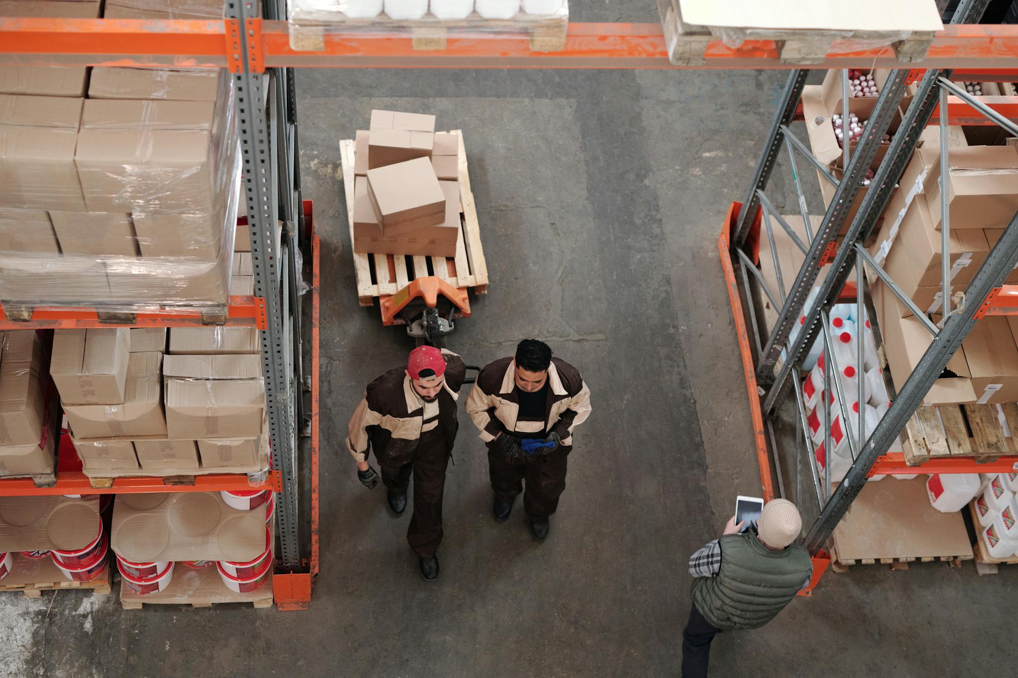 High Angle View Of Warehouse Workers Organizing