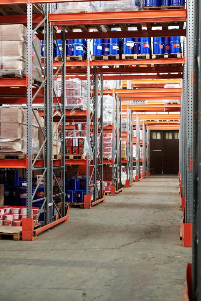 Effective Blog Promotion: Strategies to Increase Your Reach Industrial warehouse interior with organized shelves stacked with packages and goods.